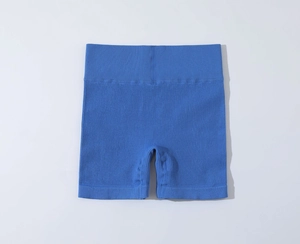 Detail of high-waisted sky blue ribbed knit yoga shorts with elastic seamless texture