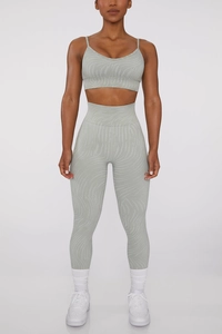 Detail of seamless high waist yoga set featuring a light green zebra print pattern