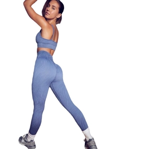 Women's seamless yoga set with ribbed knit crop top and high-waisted leggings in navy blue