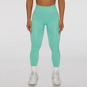 Detailed view of mint green high-waisted seamless yoga leggings for fitness and sports