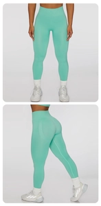 Detailed view of mint green high-waisted seamless yoga leggings with a shaping fit
