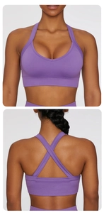 Detail of purple sports bra with deep V-neck, criss-cross back and ribbed band