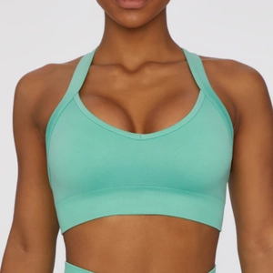 Detailed close-up of mint green sports bra with ribbed support band and V-neckline