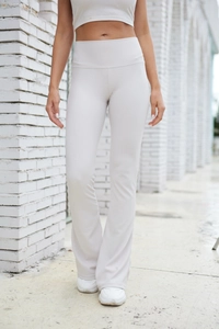 Close-up of ribbed texture on high-waisted flare leggings and matching crop top set