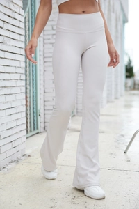 Close-up of high-waist ribbed flared yoga pants showing fabric texture and slim fit