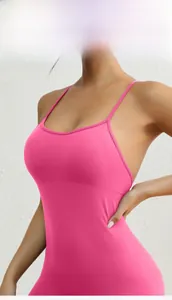 Detail of peach pink backless yoga bodysuit with thin straps and supportive U-neckline