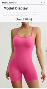 Detail of the open-back V-shaped peach butt lifting design on a pink sports bodysuit