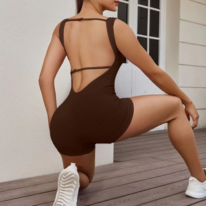 Brown ribbed seamless backless athletic bodysuit for women in a sleek outdoor setting