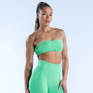 Détail du haut bandeau de yoga vert néon et legging taille haute en maille élastique