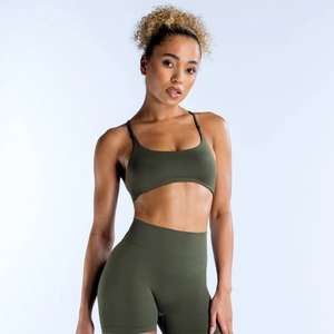Detailed view of seamless olive green yoga sports bra and high waisted fitness shorts