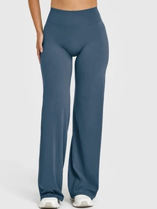 Close-up of high-waist straight yoga pants in soft blue with elastic body-shaping fit