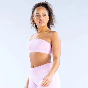 Vue latérale d'un ensemble de yoga rose sans couture avec haut tube et legging taille haute
