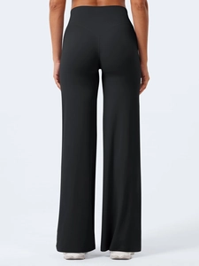 Close-up of high-waisted black yoga pants with V-shaped back stitching for contouring