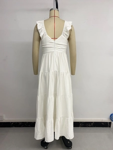 Detailed back view of white tiered maxi dress with ruffled shoulders and hidden zipper