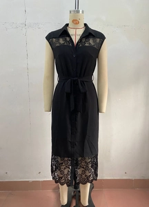 Detail of elegant black sleeveless midi dress featuring delicate floral lace and waist tie