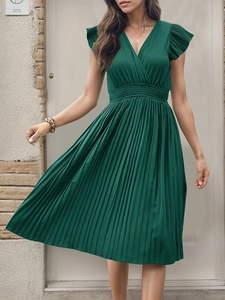 Close-up of the elegant V-neckline and pleated detail on the short sleeve dress