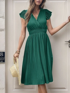 Detail of dark green V-neck pleated dress featuring ruffle sleeves and elastic waist