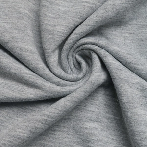 Gros plan du tissu tricoté gris chiné de qualité avec une texture de sweat épaisse et douce
