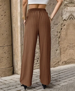 Rear view of dark brown high-waisted pleated wide-leg trousers with vertical texture