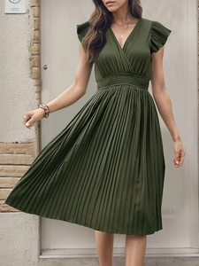 Detail of the V-neck, flutter sleeves and smocked waist on the dark green pleated dress