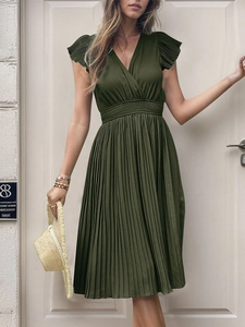 Detail of V-neck dark green pleated dress with elastic waist and soft short sleeves