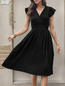 Detail of elegant black pleated V-neck dress with ruffle sleeves and high waist design