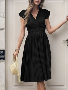 Detail view of black V-neck pleated midi dress with flutter sleeves and elastic high waist