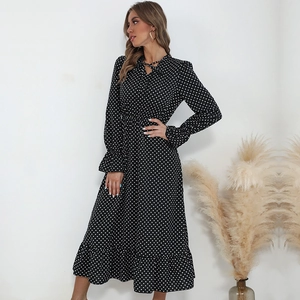 Classic black long sleeve polka dot midi dress with V-neck tie and ruffled hem details