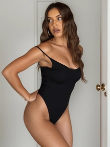 Detail of black spaghetti strap bodysuit with high-cut design and slim fit elastic fabric