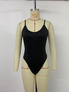 Front detail of sleek black spaghetti strap bodysuit with high-cut leg on a mannequin