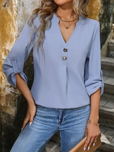 Women's light blue V-neck chiffon blouse with roll-up long sleeves and button detail