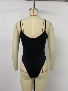 Rear view of black backless bodysuit with thin straps and high-cut leg on a mannequin
