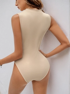 Side view of beige ribbed knit sleeveless bodysuit showing slim fit high neck detail