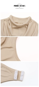 Detail view of ribbed knit bodysuit featuring high neckline and bottom snap buttons