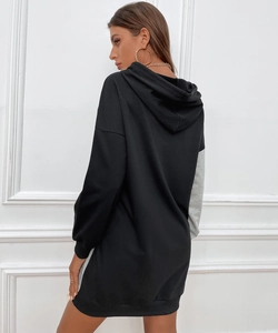 Detailed back view of oversized black and grey hooded knit sweatshirt dress with dropped sleeves