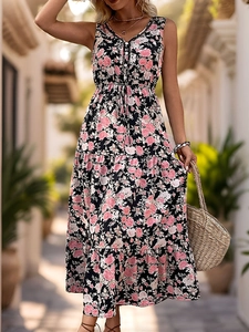 Close-up of sleeveless floral V-neck dress with button bodice and drawstring waist details