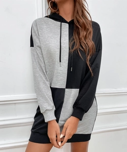 Detail view of the gray and black patchwork hoodie dress with rib-knit cuffs