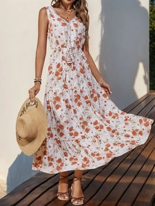 Detail of floral print maxi dress featuring V-neckline with white crochet trim and drawstring waist