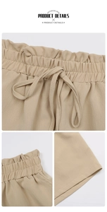 Detail view of khaki elastic waistband shorts with drawstring and ruffled edge texture
