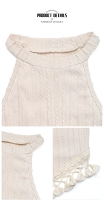 Detail of cream cable knit halter top featuring textured patterns and tassel fringe hem