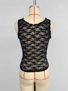 Close-up of intricate black floral lace pattern and sheer texture on a slim-fit camisole