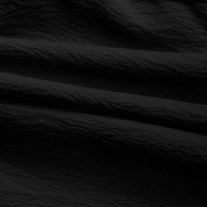 Macro shot of high-density black woven fabric texture with fine grain and subtle ripples