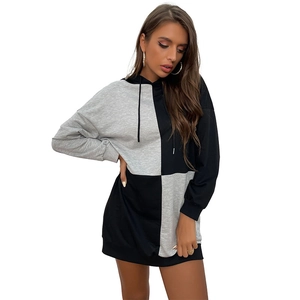 Women's casual hooded knit dress featuring black and grey contrast patchwork design