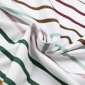 Close-up of soft striped fabric with green, pink, and burgundy bands for women's tank tops