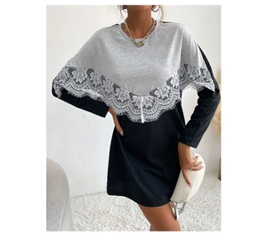 Detailed view of grey sweatshirt dress featuring elegant white V-lace stitching detail