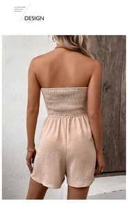 Detail view of the smocked bodice and back design of this beige high-waisted romper