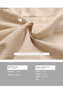 Macro consistenza del tessuto di sicurezza plissettato beige per pantaloni estivi