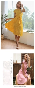 Detailed view of the pleated polka dot dress with short sleeves and waist tie design