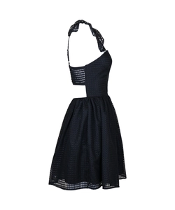 Detail of black halter dress showing textured mesh fabric and side cutout design