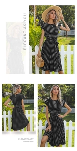 Detailed close-up of a French vintage black polka dot pleated dress with a waist tie belt